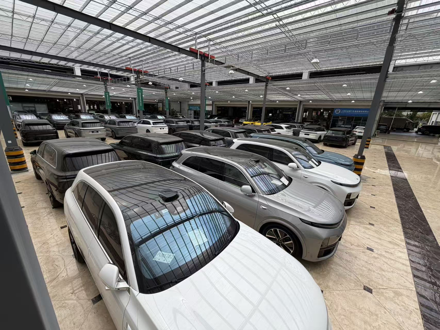 Rows of vehicles at the CARLINKAGE showroom